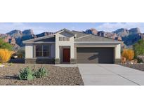 Charming single-story home features a neutral color palette, desert landscaping, and an attached two-car garage at 5824 E Axle Ln, San Tan Valley, AZ 85140