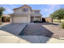 Two-story home features a well-maintained facade with a two car garage and a low maintenance front yard at 6602 S 23Rd Ave, Phoenix, AZ 85041