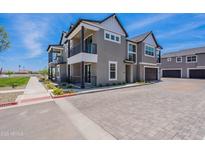 Stunning two-story home with a balcony, three-car garage and beautiful landscaping at 11300 N Casa Dega Dr # 1027, Surprise, AZ 85388