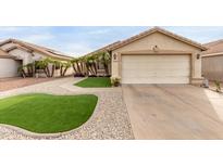 Charming single-story home with a two-car garage and desert landscaping for low maintenance at 12425 W Willow Ave, El Mirage, AZ 85335