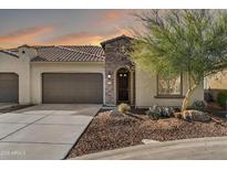 Charming single-Gathering home with well-manicured landscaping, desert accents, and a three car garage, ideal for suburban living at 16945 W Vernon Ave, Goodyear, AZ 85395