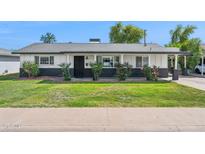 Charming single-story home featuring a landscaped front yard and a welcoming entrance at 3009 E Whitton Ave, Phoenix, AZ 85016