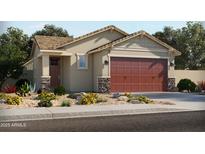 Charming single-Gathering home with stone accents, a two-car garage, and desert landscaping at 323 S San Fernando Ln, Casa Grande, AZ 85194