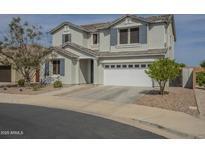Two story home featuring a two car garage, neutral color palette, and manicured landscaping at 3247 N Loma Vis, Mesa, AZ 85213