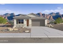 Beautiful single-story home with desert landscaping, mountain views, and a two-car garage at 46378 W Lander Ln, Maricopa, AZ 85139