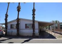 Charming single-story home with covered parking and palm trees at 625 W Mckellips Rd # 279, Mesa, AZ 85201