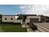Modern home exterior features a two-car garage, minimalist landscaping, and neutral color palette at 7141 E Ironwood Dr, Paradise Valley, AZ 85253
