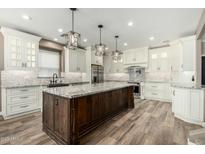 Spacious kitchen featuring a large center island, stainless steel appliances, and custom cabinetry at 1051 E Julie Ave, San Tan Valley, AZ 85140