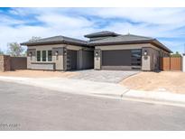 Modern home with desert landscaping, multiple-car garage, and neutral color palette at 1336 E Cherrywood Pl, Chandler, AZ 85249