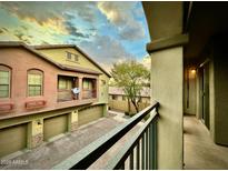 View of the property's exterior, showcasing its architecture and lovely curb appeal against a dramatic sky at 2150 E Bell Rd # 1113, Phoenix, AZ 85022