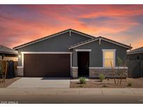 Charming single-story home featuring a two-car garage and desert landscaping at 3582 E Audrey Dr, San Tan Valley, AZ 85143