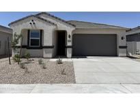 Charming single-story home featuring a two-car garage and low-maintenance desert landscaping at 46392 W Lander Ln, Maricopa, AZ 85139