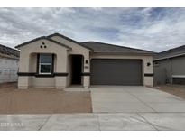 Charming single-story home with a two-car garage and a neutral color palette at 46392 W Lander Ln, Maricopa, AZ 85139