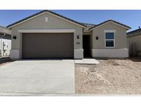 Charming single-story home with a two-car garage and neutral-colored stucco exterior at 46395 W Lander Ln, Maricopa, AZ 85139