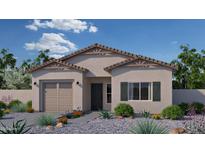 Inviting single-story home featuring desert landscaping, a two-car garage, and a neutral color palette at 766 N Don Frank Ln, Wickenburg, AZ 85390
