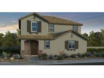 Charming two-story home with stone accents, desert landscaping, and neutral color palette at 9952 W Piccadilly Rd, Avondale, AZ 85392