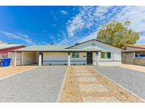 Charming single-story home with drought-tolerant landscaping and covered carport at 1510 W 7Th Dr, Mesa, AZ 85202