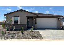 Charming single-story home featuring neutral paint, desert landscaping, and an attached two-car garage at 16071 W Remuda Dr, Surprise, AZ 85387