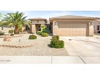 Charming single-story home featuring a low maintenance desert landscape and a two car garage at 16384 W Salado Creek Dr, Surprise, AZ 85387