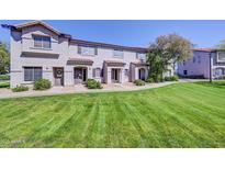 Inviting townhouse featuring a well-maintained lawn and charming architecture, perfect for comfortable living at 1961 N Hartford St # 1149, Chandler, AZ 85225