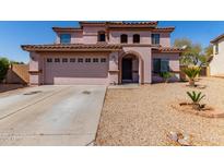 Two-story home with attached garage and desert landscaping at 4826 S 26Th Ln, Phoenix, AZ 85041