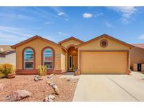 Charming single-story home with a desert-landscaped front yard and an attached two-car garage at 6831 S Coral Gable Dr, Chandler, AZ 85249