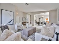 Bright living room featuring modern furniture and stylish decor accents, creating an inviting atmosphere at 7633 W Kristal Way, Glendale, AZ 85308