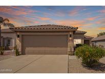 Charming single-story home with desert landscaping, tile roof, and a spacious two-car garage at 30374 N Sunray Dr, Queen Creek, AZ 85143