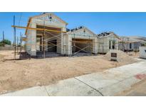 New construction featuring a three-car garage, ready for customization at 14723 N 73Rd Dr, Peoria, AZ 85381
