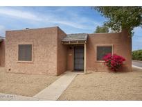 Charming single-story home featuring a stucco exterior, gravel landscaping, and a covered front entrance at 15601 N 27Th St # 37, Phoenix, AZ 85032