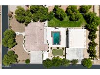 An aerial view of a home with a pool, putting green, and meticulously landscaped backyard at 21615 E Pegasus Pkwy, Queen Creek, AZ 85142