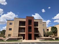 Inviting multi-story condo building featuring private balconies and a well-maintained landscape at 1340 N Recker Rd # 224, Mesa, AZ 85205