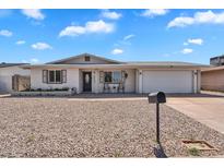 Charming single-story home with a brick facade, well-maintained yard, and a two-car garage at 625 S Daley --, Mesa, AZ 85204