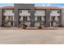 View of apartment building with multiple units, stairs leading to entry doors, and a red tile roof at 1215 E Lemon St # 222, Tempe, AZ 85281