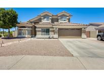 Two-story home with tile roof, desert landscaping, and a two-car garage at 1266 S Harrington St, Gilbert, AZ 85233