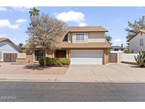 Charming two-story brick home featuring a two-car garage and desert landscaping in front yard at 2619 S Los Altos --, Mesa, AZ 85202