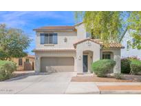 Two-story home featuring a two-car garage and a welcoming front entrance at 2950 E Dublin St, Gilbert, AZ 85295