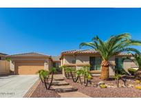 Charming single-story home with a well-manicured front yard, desert landscaping, and a paved walkway at 6528 W Brookhart Way, Phoenix, AZ 85083