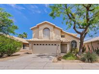 Charming two-story home with a well-manicured front yard and a neutral-colored exterior at 4422 E Dry Creek Rd, Phoenix, AZ 85044