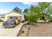 Charming single-story home featuring a spacious driveway and low-maintenance desert landscaping at 5253 E Waltann Ln, Scottsdale, AZ 85254