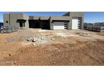 Contemporary home featuring a clean-lined design with a white sectional garage door on a sunny day at 1250 E Smokehouse Trl, Phoenix, AZ 85085