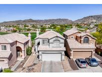 Charming two-story home with a desert landscape, tile roof, and a view of the mountain at 16610 S 21 St, Phoenix, AZ 85048