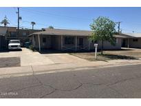 Charming single-story home with mature tree and covered entry at 3419 W Glenn Dr, Phoenix, AZ 85051