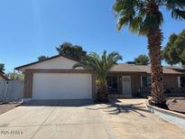 Charming single-story home with desert landscaping and a two-car garage at 4309 E Alta Mesa Ave, Phoenix, AZ 85044