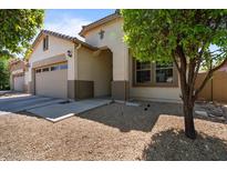 Inviting single-Gathering home featuring a two-car garage and desert landscaping at 4617 W Cottontail Rd, Phoenix, AZ 85086