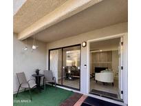 Charming outdoor patio with comfortable seating and sliding glass doors leading inside at 850 S River Dr # 1085, Tempe, AZ 85281