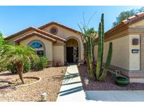 Charming single-story home featuring desert landscaping, a walkway, and a welcoming entrance at 15395 W Pinchot Ct, Goodyear, AZ 85395