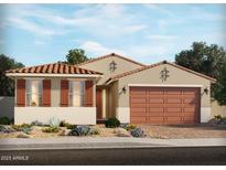 Inviting single-story home featuring a terracotta roof, a two-car garage, decorative shutters, and professionally landscaped front yard at 138 N 175Th Ave, Goodyear, AZ 85338
