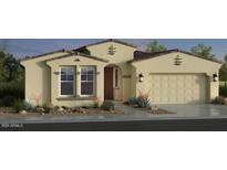 Beautiful single story home with a two car garage and neutral colored stucco exterior at 16928 W Jenan Rd, Surprise, AZ 85388