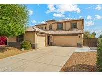 Charming two-story home with a three car garage and beautiful desert landscaping at 3370 E Flamingo Ct, Gilbert, AZ 85297